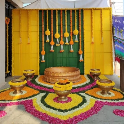 Vibrant turmeric themed Haldi ceremony decoration with yellow florals by Pranaya Weddings Chennai
