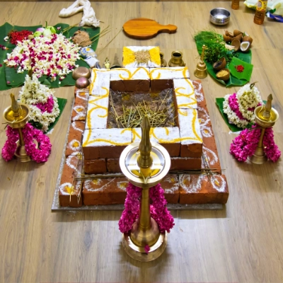 Structured fire altar Homam setup with earthy traditional decor by Pranaya Weddings Chennai
