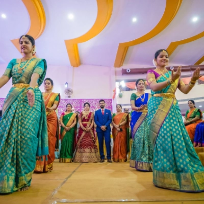 Energetic Sangeet stage with statement backdrop & dance floor setup by Pranaya Weddings Chennai
